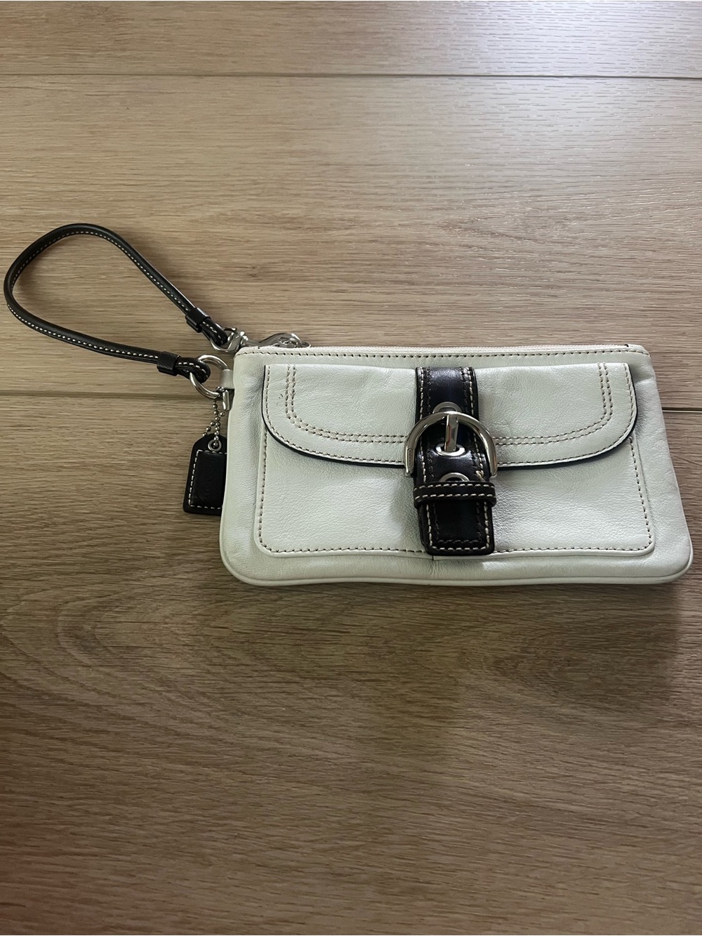 Coach leather wristlet in white and brown